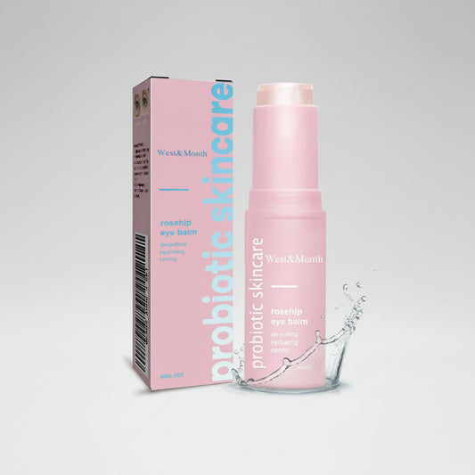 Pink probiotic skincare eye balm packaging with box on a white background